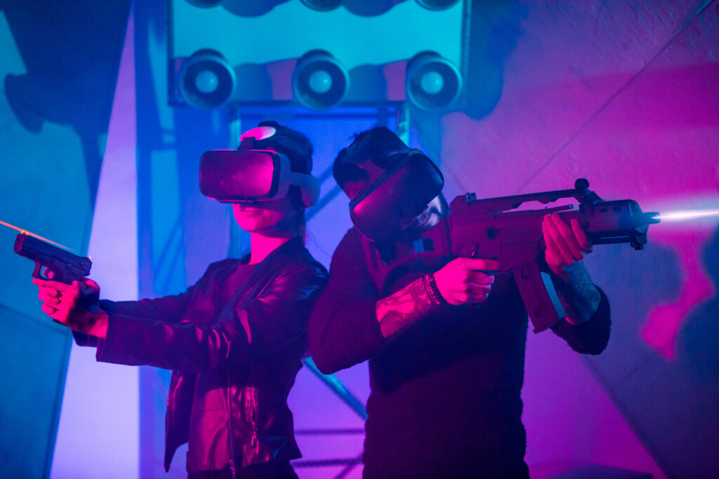 Couple Playing Virtual Reality Shooter Using Headset