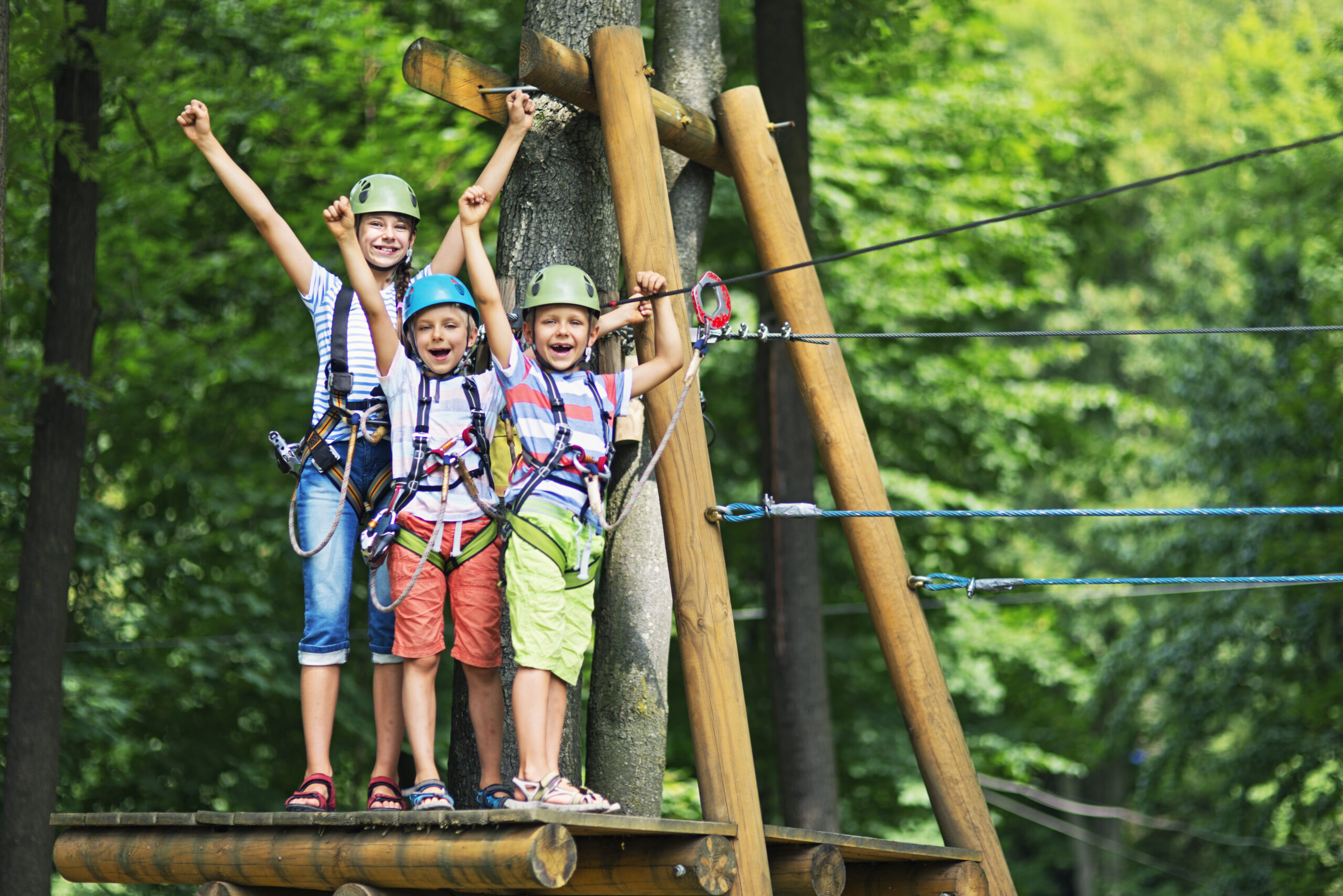 Kids having fun in ropes course adventure park