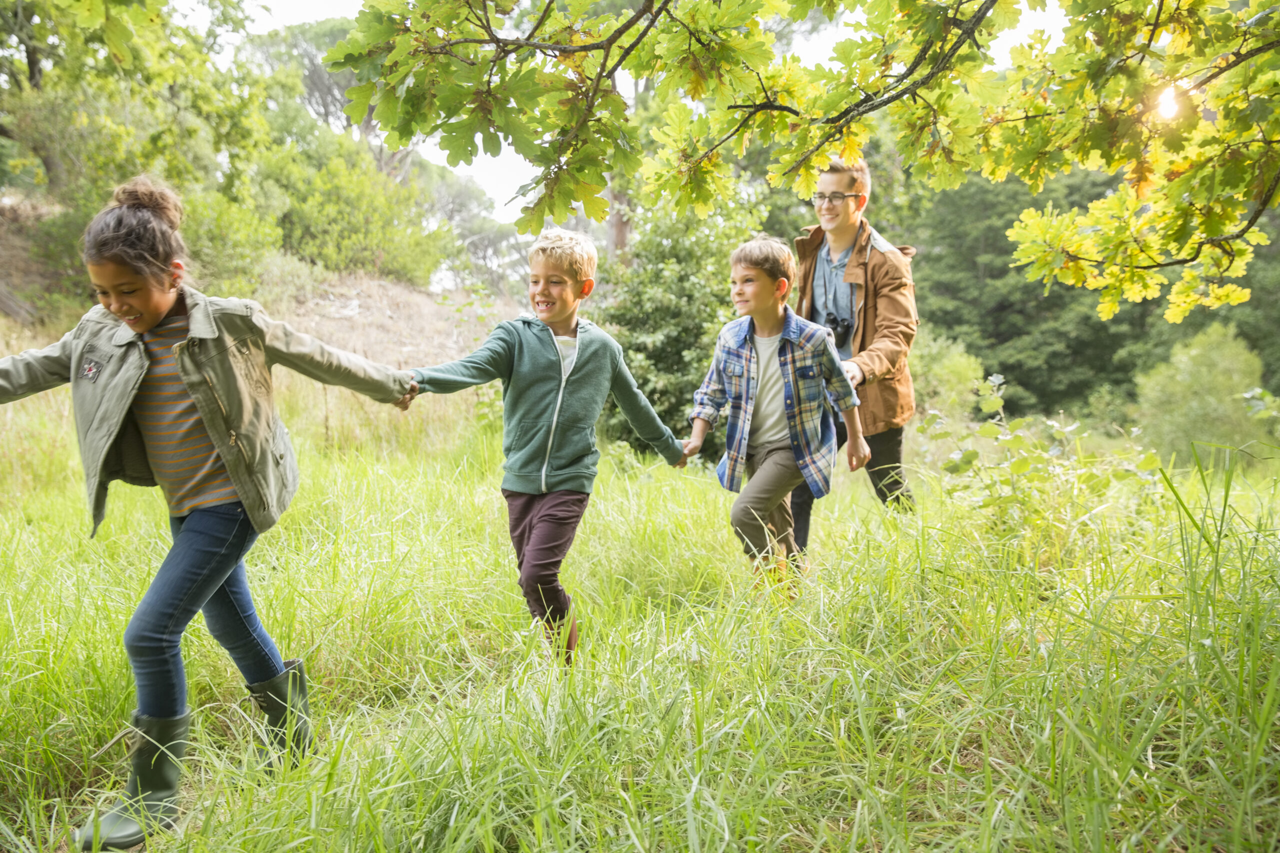 Students and teacher walking outdoors